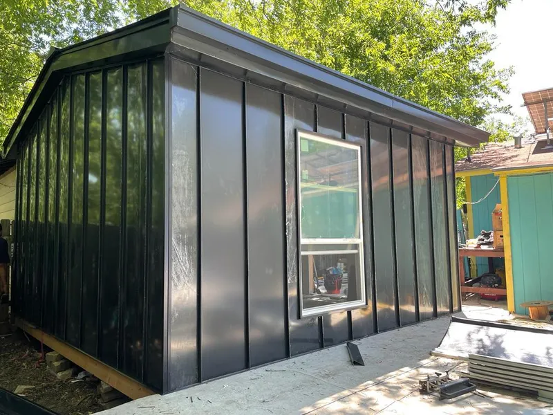 Black standing seam metal wall panels for Roof Inspection in Muscatine